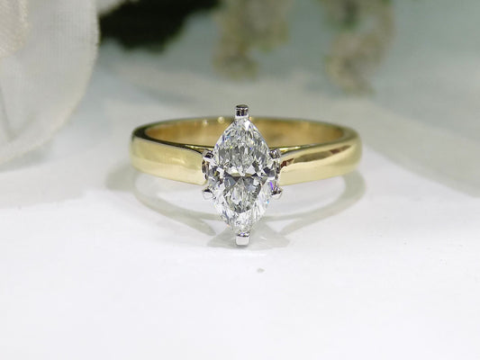 Ladies' 1.01ct Marquise Shape Natural Diamond Solitaire in a 14K Yellow Gold Cathedral Style Mounting
