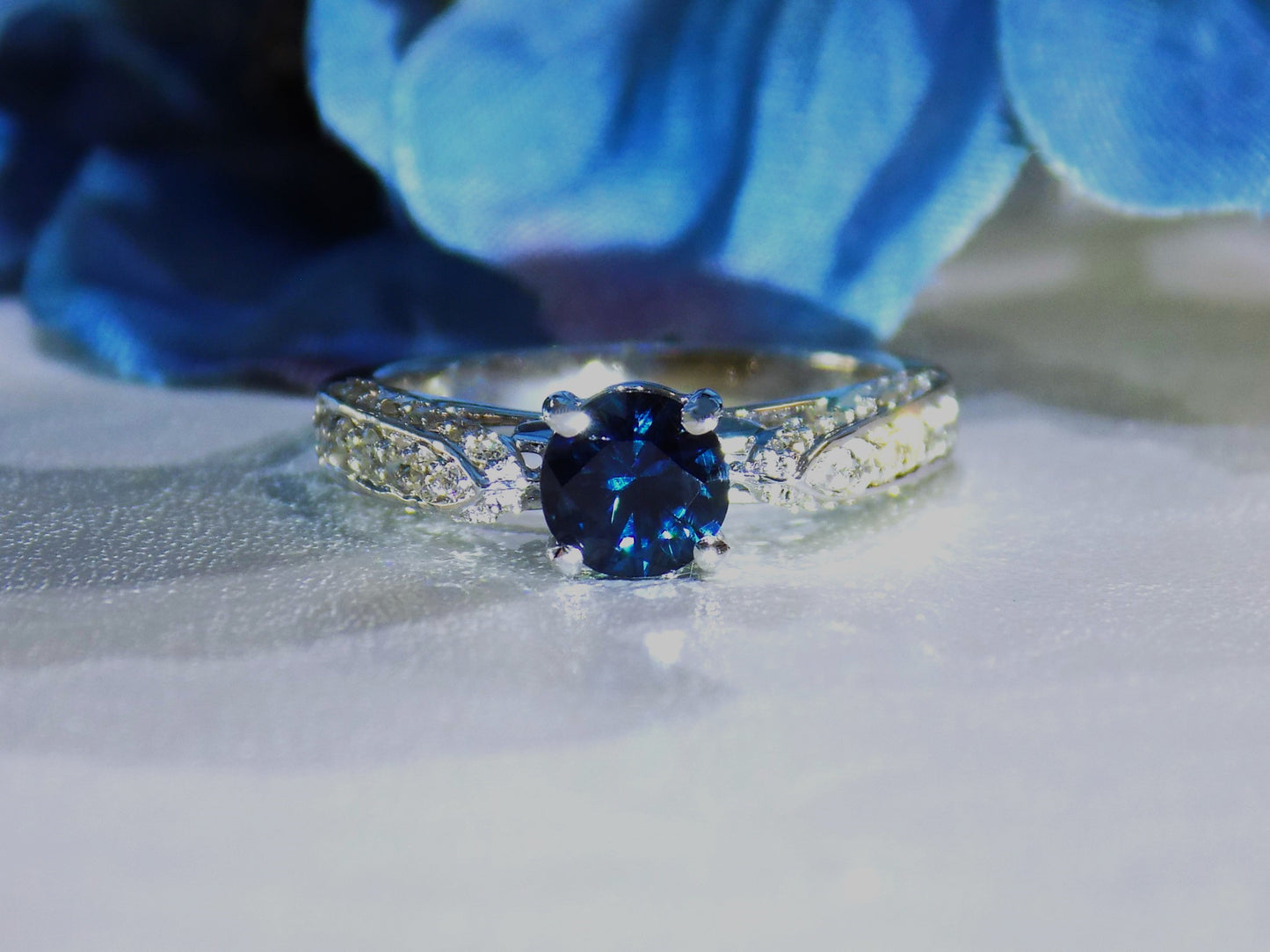 1.74ct TW Natural Blue Diamond Ring with a .89ct Round Blue Diamond Center in 18K White Gold