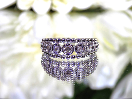 Women's .20ct TW Bezel Set Natural Round Brilliant Diamond Beaded Style Band in 10K White Gold