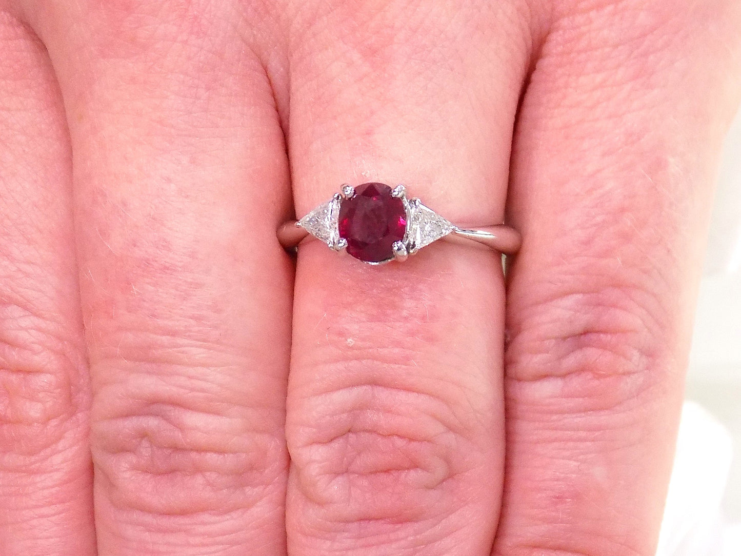 1.51ct Vintage Genuine High Quality Natural Pigeon Blood Oval Shape Ruby with a Natural Trillion Shape Diamond on Either Sider in Platinum