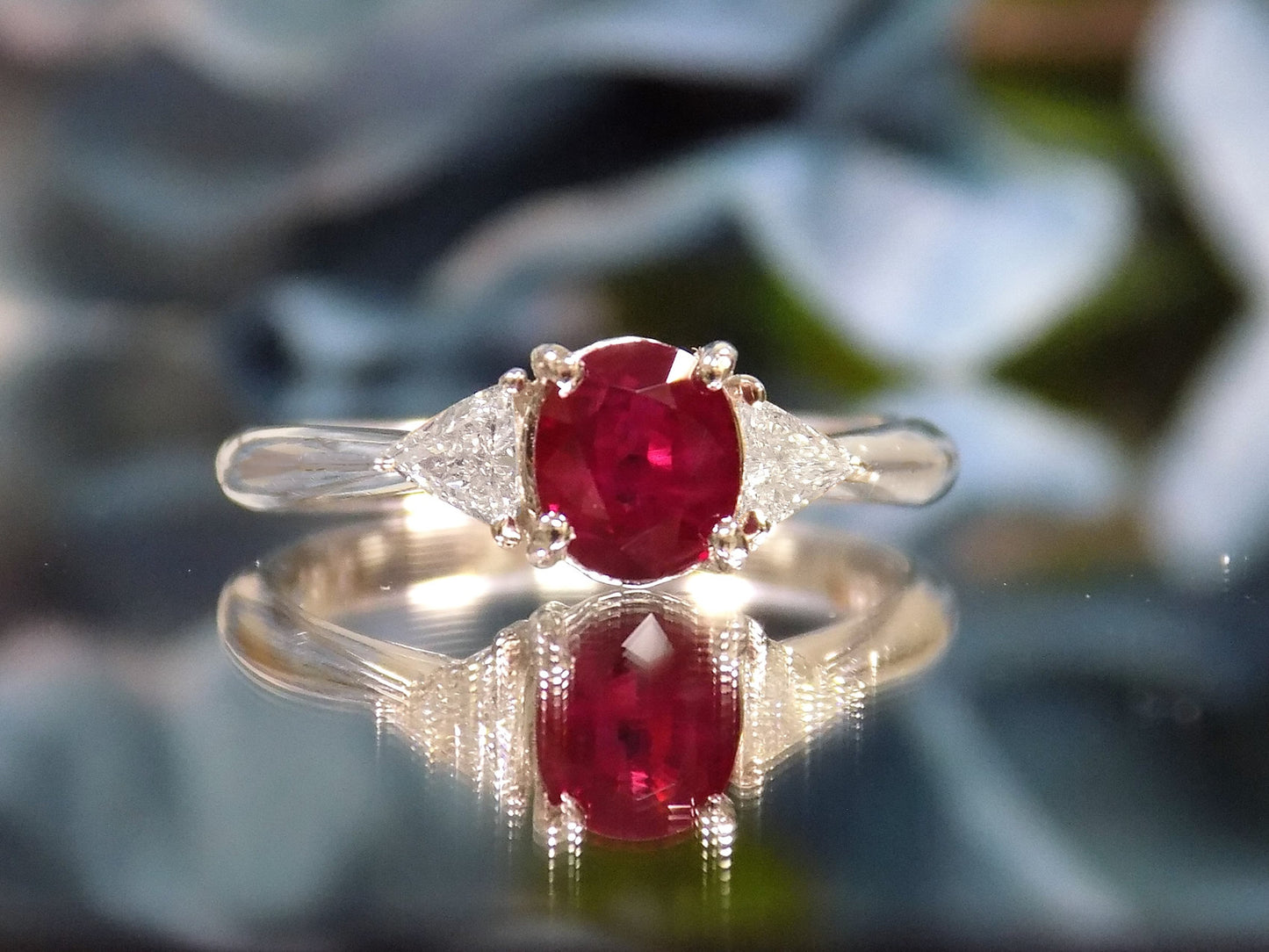 1.51ct Vintage Genuine High Quality Natural Pigeon Blood Oval Shape Ruby with a Natural Trillion Shape Diamond on Either Sider in Platinum